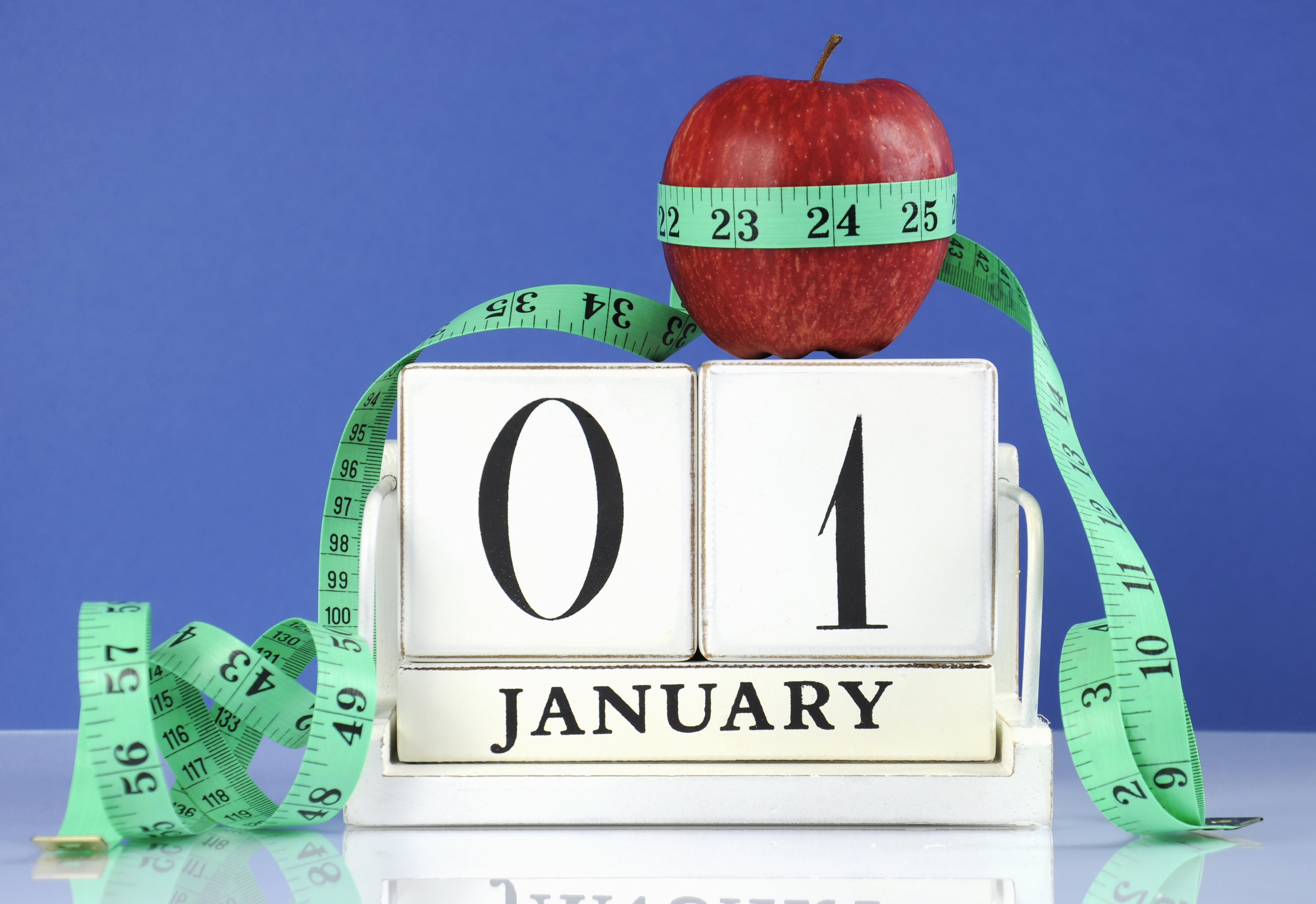 Happy New Year healthy slimming weight loss or good health resolution with red apple and